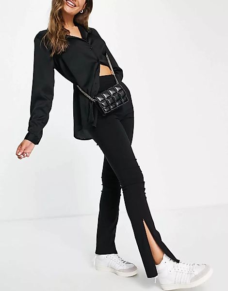 Topshop – Eng geschnittene Hose in Schwarz mit Reißverschluss am Saum günstig online kaufen