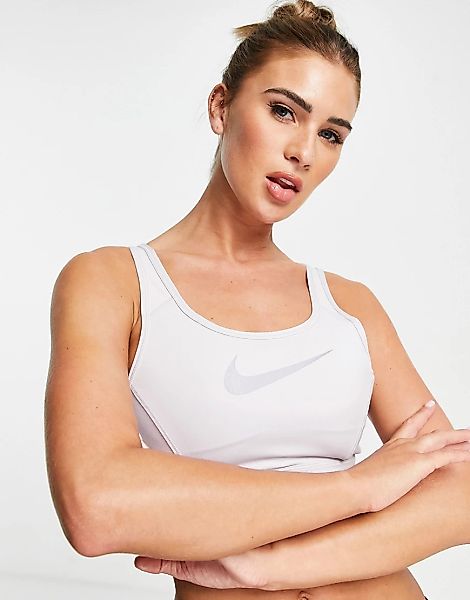 Nike Training – Femme Dri-FIT – Sport-BH in Flieder mit mittlerer Stützfunk günstig online kaufen