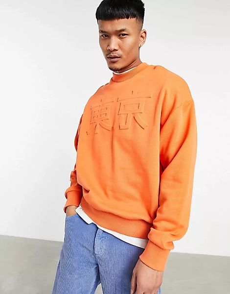 ASOS DESIGN – Oversize-Sweatshirt mit geprägtem Text-Print in Orange günstig online kaufen
