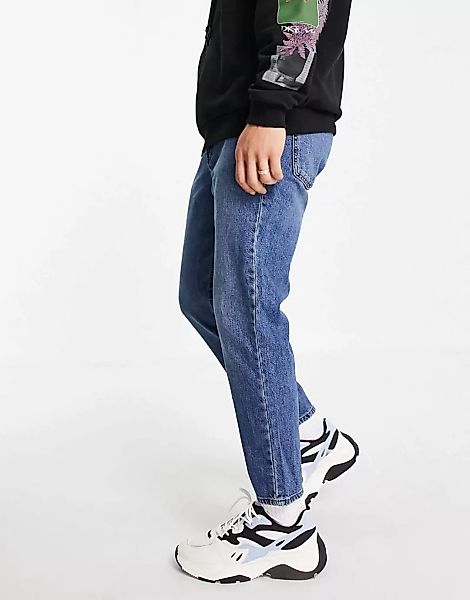 ASOS DESIGN – Klassische, steife Jeans in dunkler Vintage-Waschung-Blau günstig online kaufen