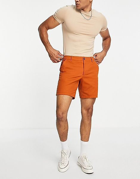 ASOS DESIGN – Schmal geschnittene Chino-Shorts in Rostorange günstig online kaufen