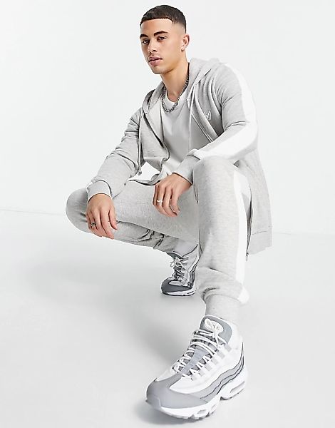 Jack & Jones – Trainingsanzug in Grau mit seitlichen Streifen günstig online kaufen