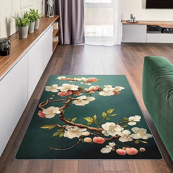 Teppich Zweig mit Blüten auf Türkis günstig online kaufen