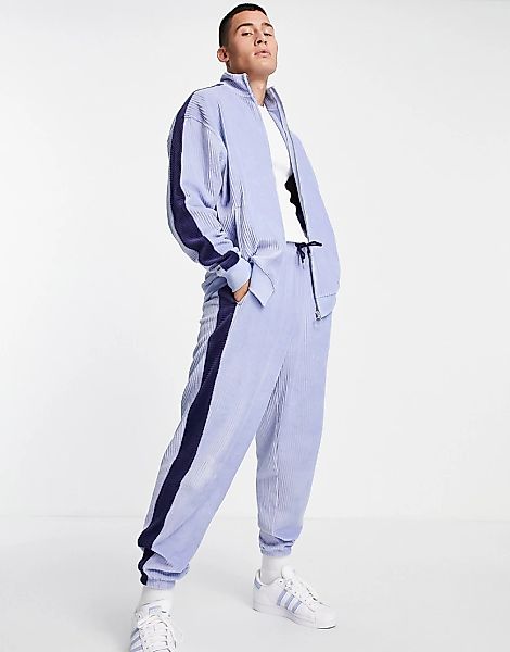 ASOS DESIGN – Gerippte Oversize-Trainingsjacke aus Velours in Blau mit seit günstig online kaufen