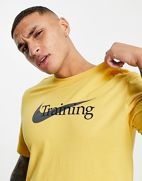 Nike Training – T-Shirt in Gelb mit Schriftzuglogo günstig online kaufen