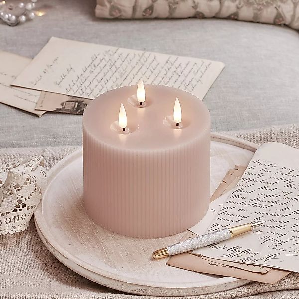 TruGlow® LED Kerze rosa geriffelt mit 3 Dochten mit Fernbedienung günstig online kaufen