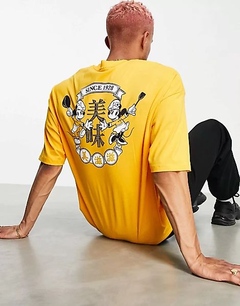 ASOS DESIGN – Locker geschnittenes T-Shirt in Orange mit Micky Maus-Aufdruc günstig online kaufen