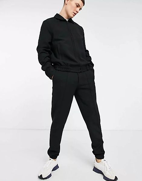 ASOS DESIGN – Elegante Jogginghose mit engem Schnitt aus schwarzem Crepe, K günstig online kaufen