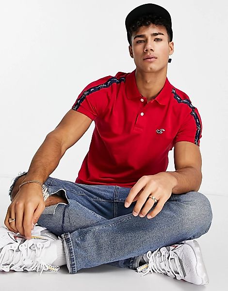 Hollister – Polohemd in Rot mit Markenlogo und Logostreifen am Ärmel günstig online kaufen