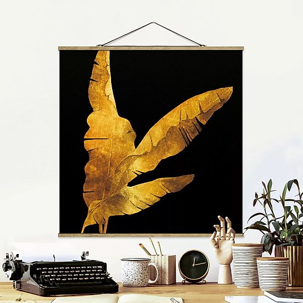 Stoffbild Blumen mit Posterleisten - Quadrat Gold - Bananenpalme auf Schwar günstig online kaufen