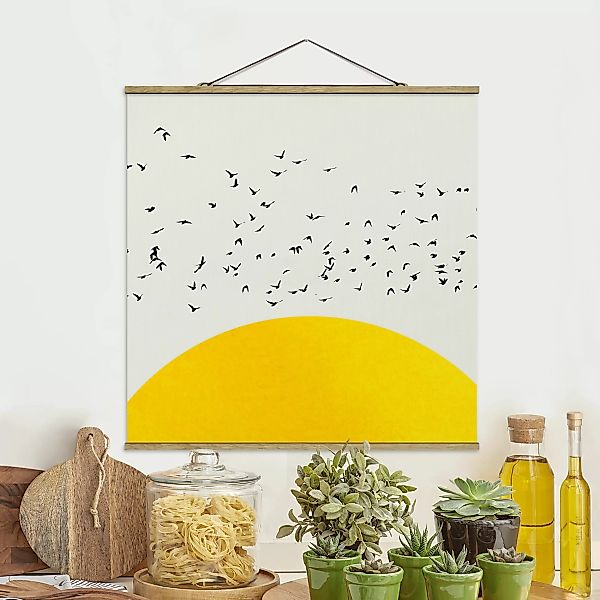 Stoffbild mit Posterleisten Vogelschwarm vor gelber Sonne günstig online kaufen