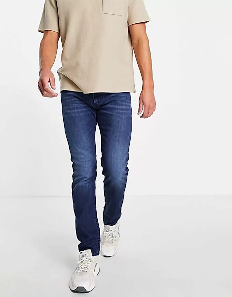 Diesel – Thommer-x – Jeans in mittlerer Waschung mit schmalem Bein-Blau günstig online kaufen