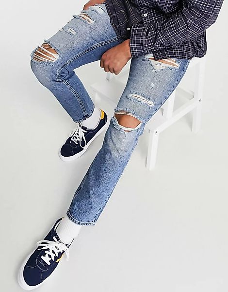 ASOS DESIGN – Schmal geschnittene Jeans mit extremen Rissen, verwaschenes M günstig online kaufen