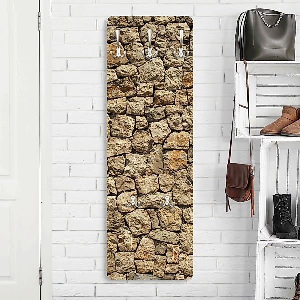 Wandgarderobe Holzpaneel Muster & Textur Alte Wand aus Pflasterstein günstig online kaufen