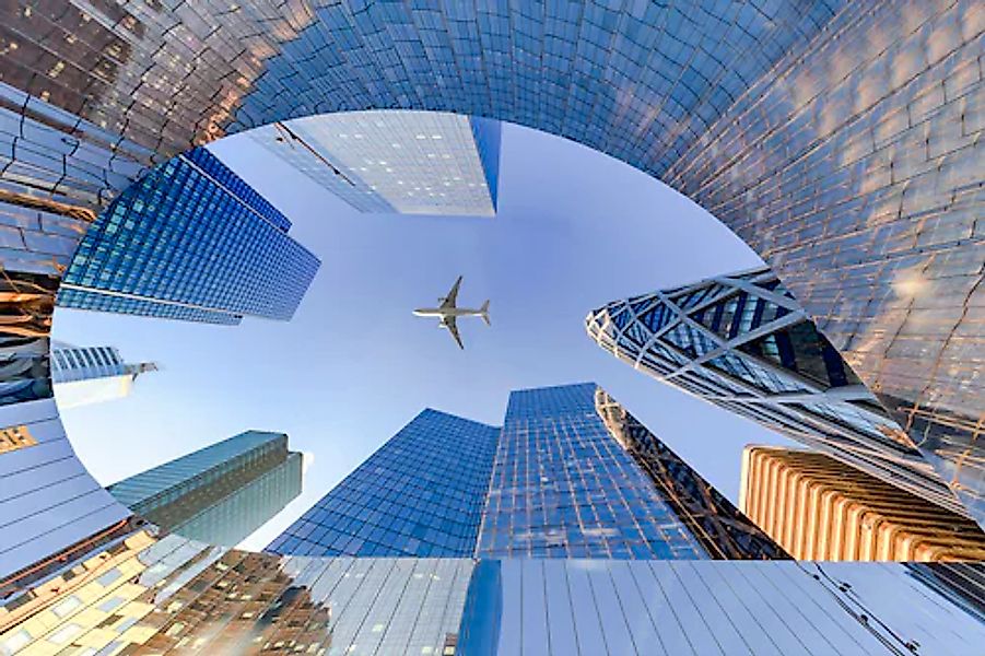 Papermoon Fototapete »Flugzeug über Stadt« günstig online kaufen