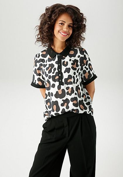 Aniston CASUAL Kurzarmbluse im extravaganten Animal-Print- jedes Teil ein U günstig online kaufen