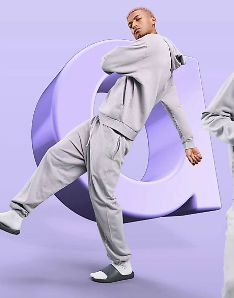 ASOS – Dark Future – Lockere Jogginghose in fliederfarbener Waschung mit Lo günstig online kaufen
