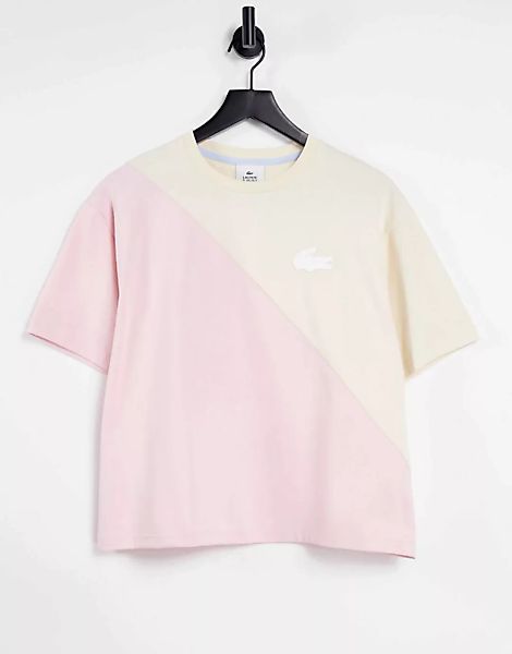 Lacoste – T-Shirt mit zweigeteiltem Design in Rosa und Cremeweiß günstig online kaufen