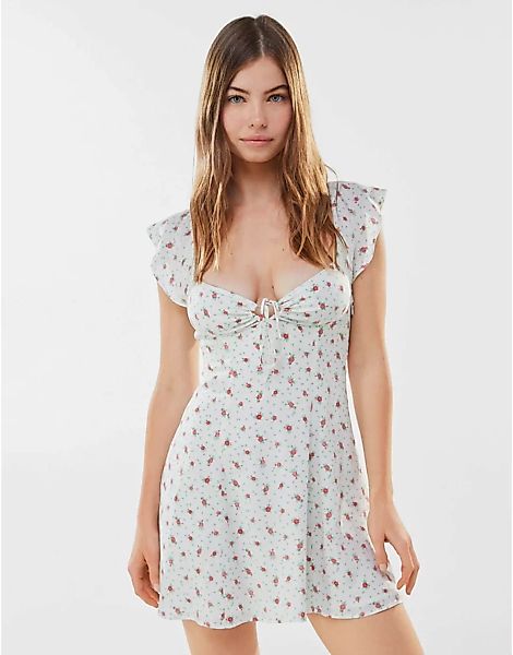Bershka – Minikleid mit Blumenmuster und Schnürung hinten in Ecru-Weiß günstig online kaufen