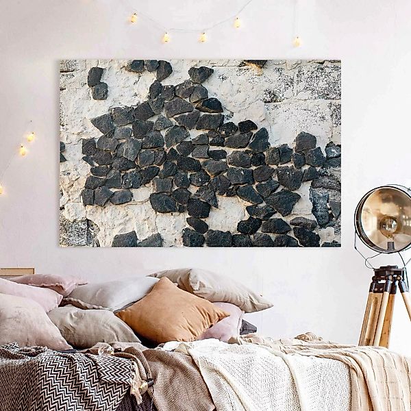 Leinwandbild Mauer mit Schwarzen Steinen günstig online kaufen