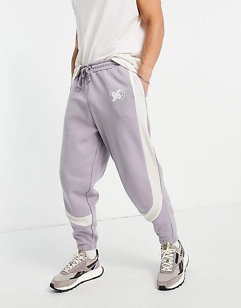ASOS DESIGN – Oversize-Jogginghose in Grau mit Farbblockdesign und Rippenve günstig online kaufen
