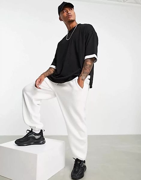 ASOS DESIGN – Doppellagiges Oversize-T-Shirt in Schwarz mit halblangen Ärme günstig online kaufen