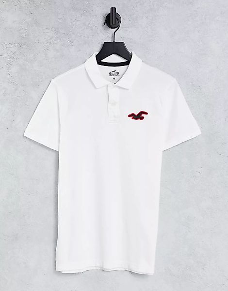 Hollister – Exploded – Pikee-Polohemd in Weiß mit gummiertem Logo günstig online kaufen
