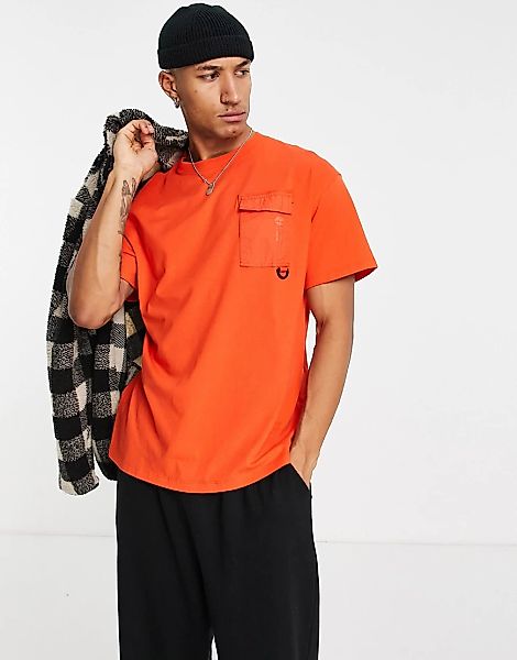 Timberland X Raeburn – T-Shirt in Orange mit Tasche günstig online kaufen