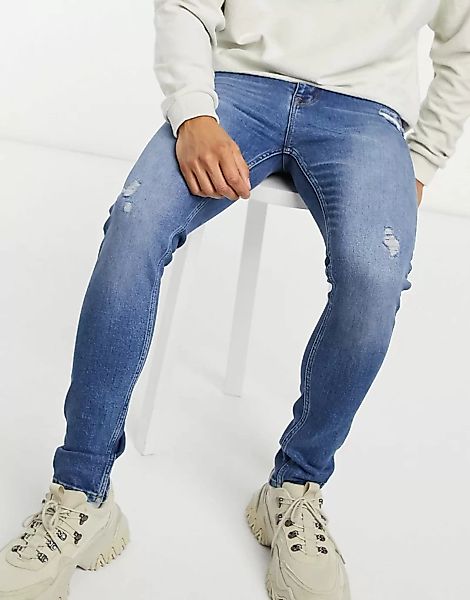 ASOS DESIGN – Extrem enge Jeans mit Abnutzungen in dunkler Waschung-Blau günstig online kaufen