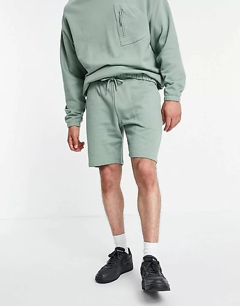 ASOS DESIGN – Schmale, kürzere Jersey-Shorts in Grün, Kombiteil günstig online kaufen