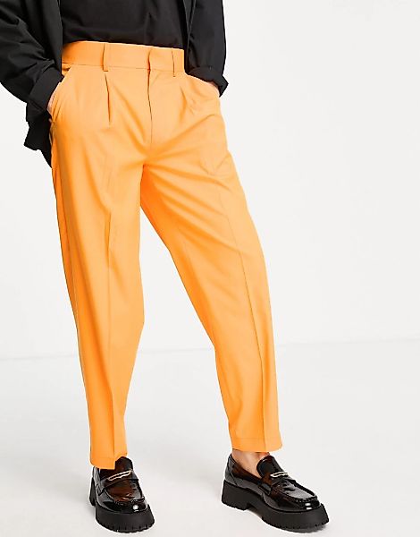 ASOS DESIGN – Schmal zulaufende, elegante Oversize-Hose in Orange günstig online kaufen