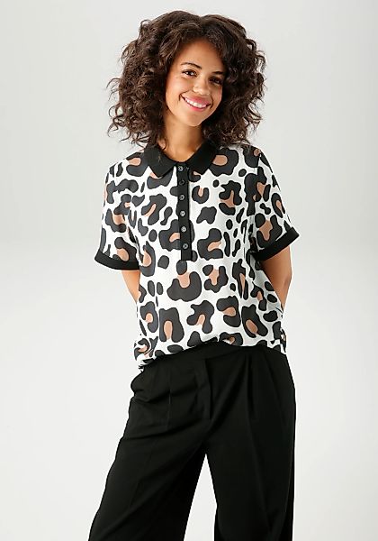 Aniston CASUAL Kurzarmbluse im extravaganten Animal-Print- jedes Teil ein U günstig online kaufen