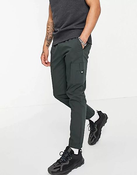 ASOS DESIGN – Eng geschnittene Hose aus dunkelgrünem Nylon mit MA1-Tasche günstig online kaufen