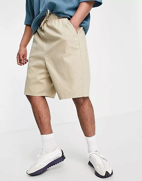 ASOS DESIGN – Shorts mit niedrigem Schnitt und elastischem Bund in Beige-Ne günstig online kaufen