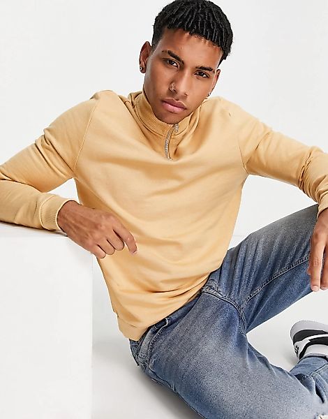 ASOS DESIGN – Sweatshirt aus Bio-Baumwolle in Pastellorange mit kurzem Reiß günstig online kaufen