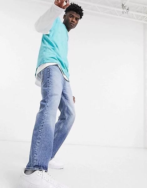 ASOS DESIGN – Bootcut-Jeans mit dunkelblauer Waschung im Stil der 90er günstig online kaufen