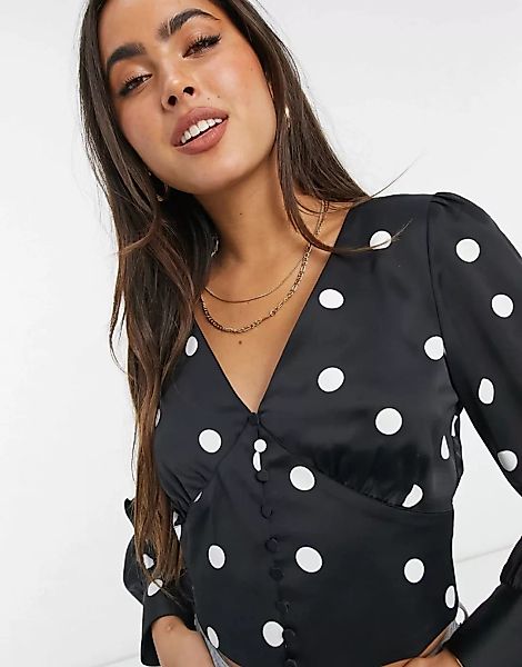 Y.A.S – Bluse mit V-Ausschnitt und Knopfdetail, in Schwarz mit weißen Punkt günstig online kaufen