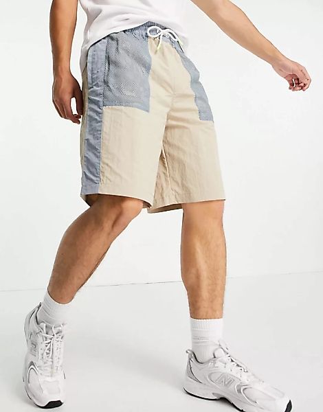 Tommy Jeans – Mix Media – Shorts aus Tech-Stoff in weichem Beige mit Farbbl günstig online kaufen