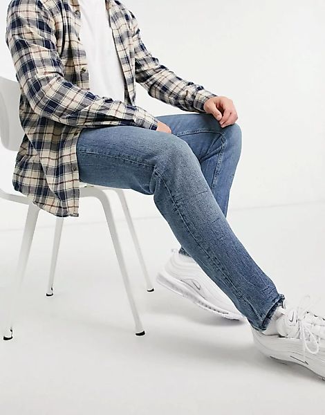 ASOS DESIGN – Schmal zulaufende Stretch-Jeans in mittelblauer Vintage-Wasch günstig online kaufen