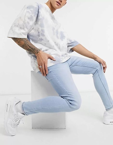 Bershka – Superenge Jeans in hellblauer Waschung günstig online kaufen