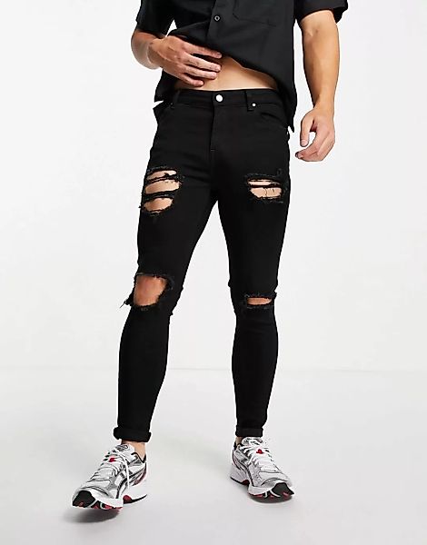 ASOS DESIGN – Schwarze Sprayon-Jeans mit Powerstretch und großen Rissen günstig online kaufen