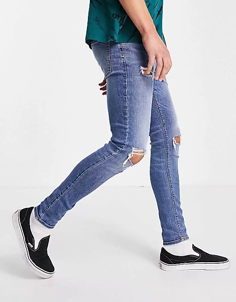 ASOS DESIGN – Hautenge Jeans mit Power-Stretch und Zierrissen in mittlerer günstig online kaufen